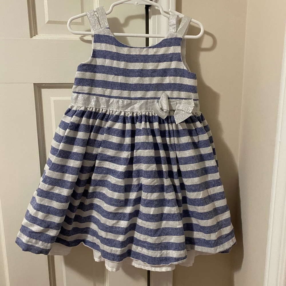 Stripe dress with silver accent bow and arm straps. Lovely buttons in the back.